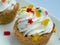 Appetizing cake with whipped cream and pastry decorations.