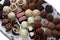 Appetizing chocolate candies assortment, close-up