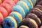 Appetizing colorful donuts closeup, background or texture