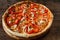 Appetizing colorful fresh pizza on wooden table