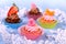 Appetizing cupcakes with angel, heart, tangerine, strawberry