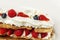 Appetizing dessert with berries. Cookies with strawberries and raspberries. Close-up