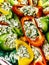 Appetizing fresh vegetable food, closeup detailed view of colourful delicious peppers with cheese