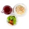 Appetizing fried chicken wing, plate with rice and jug with berry drink on a white plate, top view