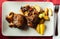 Appetizing fried pork cheeks with potatoes