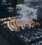 Appetizing grilled sausages. Assorted fried meat on the grill