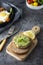 Appetizing guacamole, avocado pasta sandwich. Mexican guacamole. Delicious green snack from avocado