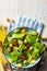 Appetizing and healthy low calorie vegetarian salad with spinach sprouts, fresh apple, tomatoes and toast. Mediterranean diet.