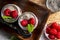Appetizing, healthy and refreshing chia seed pudding with fresh raspberries, mint leaves and cookies. Vegetarian and vegan food