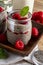 Appetizing, healthy and refreshing chia seed pudding with fresh raspberries, mint leaves and cookies. Vegetarian and vegan food