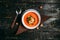 Appetizing healthy vegetable soup on the napkin on the wooden table