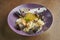 Appetizing homemade tagliatelli with mussels, shrimp and squid, parmesan cheese in a bowl on a wooden background. Add noise on