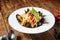 Appetizing italian seafood pasta with mussels in a white plate