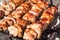 Appetizing kebab is baked on hot coals