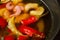 Appetizing looking seafood soup with mussels shrimp red pepper in a plate on a wooden table. fresh seafood. shrimp in