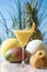 An appetizing mango juice in a martini glass with an apricot slice. Vegan and healthy food concept