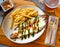 Appetizing Milanesa caprese veal served with french fries