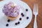 Appetizing muffin with blueberry cream