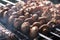 Appetizing mushrooms close-up on the grill on the background of roasting kebab