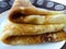 Appetizing pancakes on a plate. Appetizing pancakes on a plate. Homemade thin crepes for breakfast or dessert