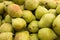 appetizing pears on counter in market