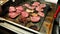 Appetizing pieces of fried beef and turkey meat on a large baking sheet in the hotel restaurant