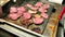 Appetizing pieces of fried beef and turkey meat on a large baking sheet in the hotel restaurant