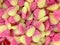 Appetizing pink-yellow jelly candies in the form of hearts close