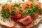 Appetizing red fish sandwich, marinated salmon, on a piece of bread with bran, decorated with chopped dill