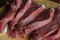 Appetizing red fresh veal  sliced into raw thin beef steaks