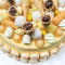 Appetizing round handmade cake decorated with sweets close-up