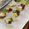 Appetizing salad in a transparent salad bowl, food closeup