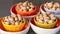 Appetizing snack calorie pistachio nut in colorful bowls