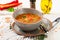 Appetizing soup with red lentils, meat, red paprika