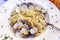 Appetizing spaghetti with mussels in a plate on the table. Close-up