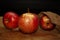 Appetizing succulent apples ready to eat on wooden board