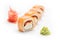 Appetizing sushi rolls with salmon, flying fish roe and Philadelphia cheese. Isolated. Sushi roll on a white background.