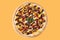 appetizing sweet kids pizza with chocolate and berries on yellow background, studio shot