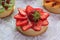 Appetizing tartlet with strawberry, apricot, kiwi, granatum.