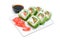 Appetizing tasty Japan rolls on a plate on a white background.