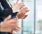 Applauding a masterful presentation. Closeup shot of a group of executives clapping while standing in a row in an office