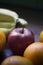 Apple, bananas and Oranges over wooden table