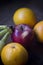 Apple, bananas and Oranges over wooden table