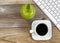 Apple and black coffee with computer keyboard for school or offi