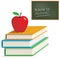 Apple on books with chalkboard