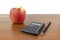 Apple calculator handle lie on the table.