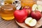 Apple cider vinegar on wooden board, Kombucha tea with apple slices, Healthy probiotic nutrition drink.