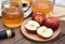 Apple cider vinegar on wooden board, Kombucha tea with apple slices, Healthy probiotic nutrition drink.