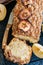 Apple cinnamon streusel cake on a wire rack on a blue stone back