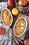 Apple clafoutis in two ceramic dish for sweet breakfast and red apples